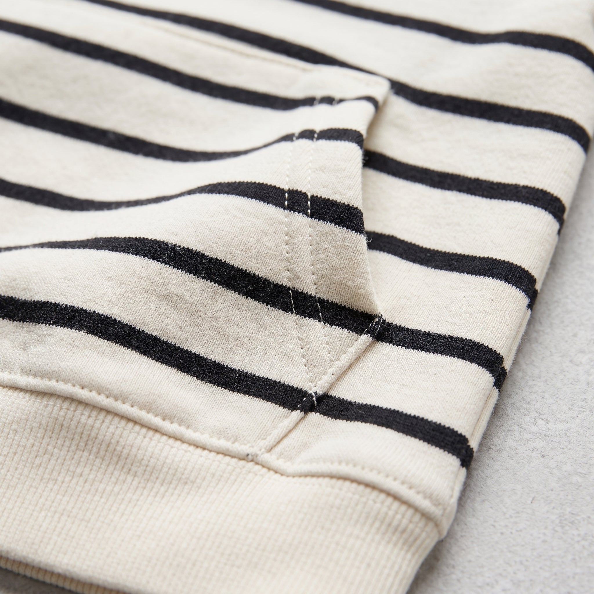 Figo Classic Stripe Hoodie - kangaroo pocket detail, white striped French terry hoodie